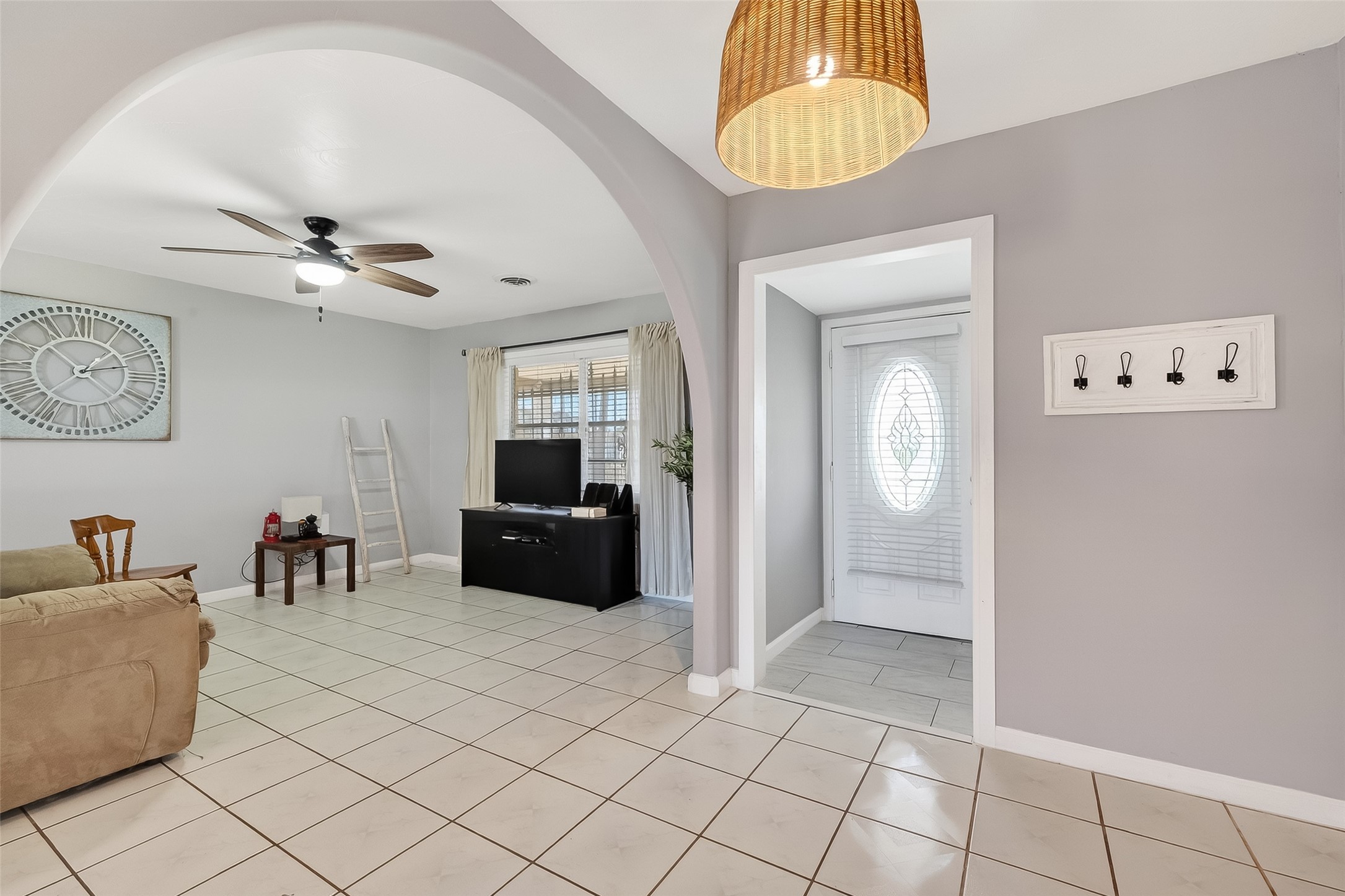 16415 1st Street Channelview, TX 77530 - Photo 4 of 28 a living room with a couch and a chandelier
