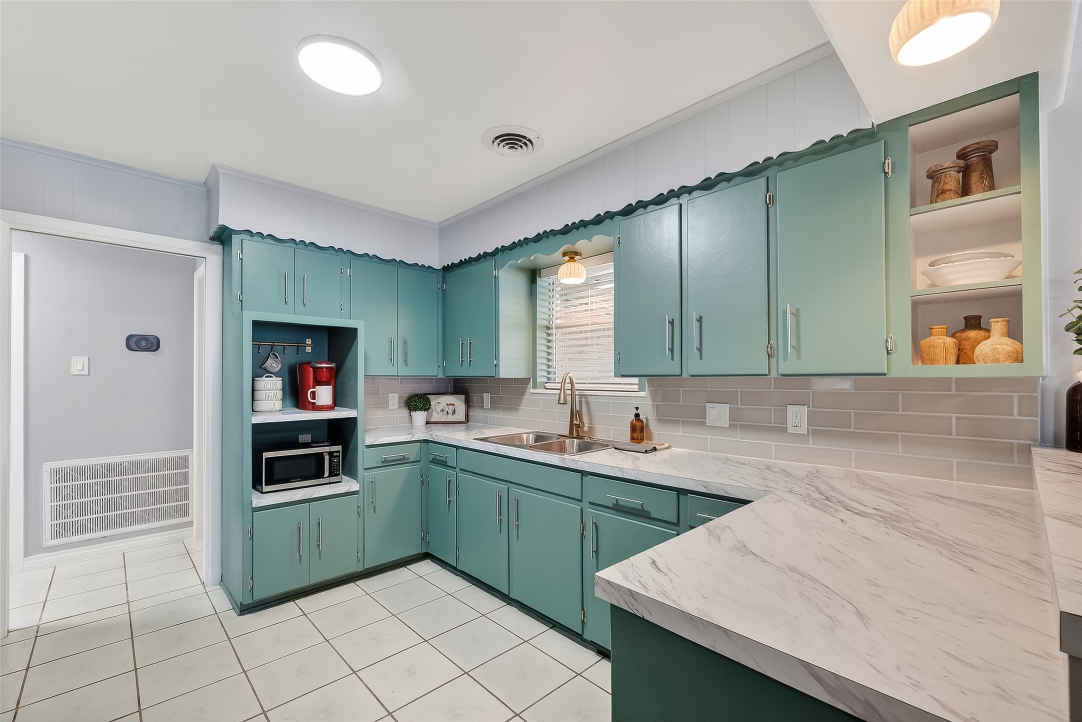 16415 1st Street Channelview, TX 77530 - Photo 10 of 28 a kitchen with a sink and cabinets