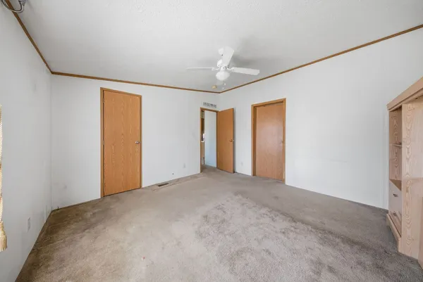 a view of empty room with windows