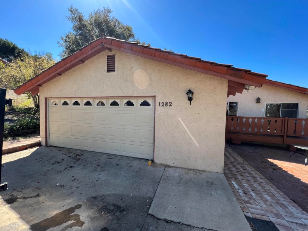 1282 Riverview Drive Fallbrook, CA 92028 - Photo 1 of 1 a front view of a house with garden