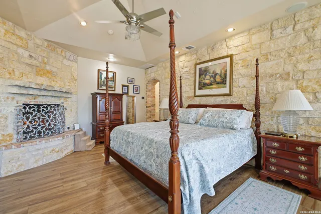 a spacious bedroom with a bed and a table