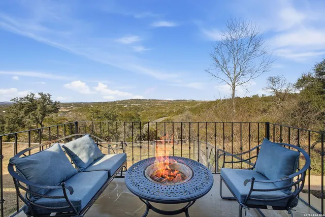 a view of a chairs and table in the patio