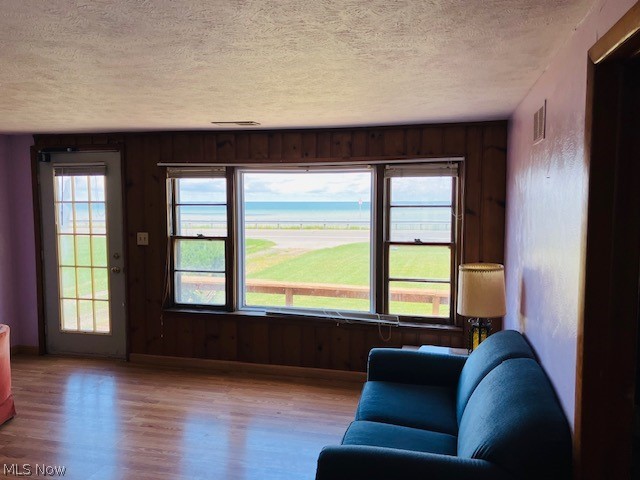 4374 Lake Road East Geneva, OH 44041 - Photo 2 of 19 Living room with hardwood / wood-style flooring and a textured ceiling