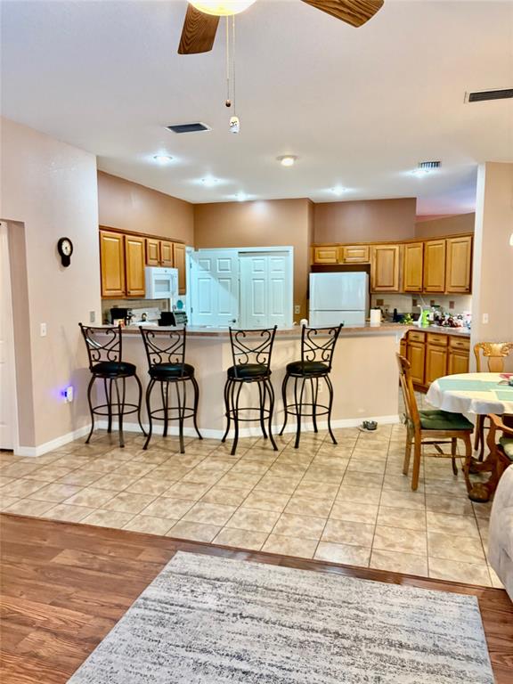 18970 Southwest 99th Street Dunnellon, FL 34432 - Photo 17 of 52 a view of a dining hall with furniture