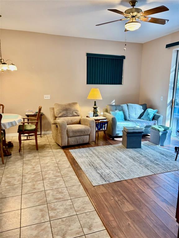 18970 Southwest 99th Street Dunnellon, FL 34432 - Photo 18 of 52 a living room with furniture and wooden floor