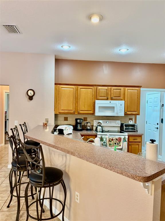 18970 Southwest 99th Street Dunnellon, FL 34432 - Photo 21 of 52 a kitchen with a sink counter top space and appliances