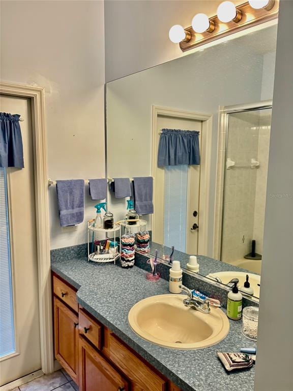 18970 Southwest 99th Street Dunnellon, FL 34432 - Photo 25 of 52 a bathroom with a sink double vanity and a mirror