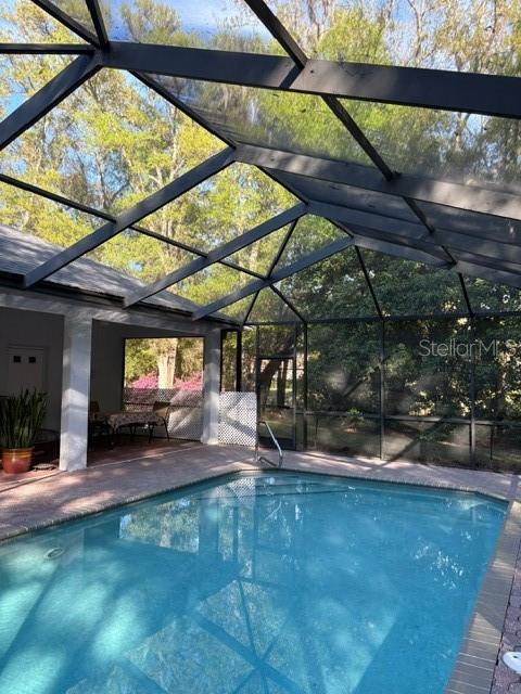 18970 Southwest 99th Street Dunnellon, FL 34432 - Photo 37 of 52 a view of a backyard with plants and a patio