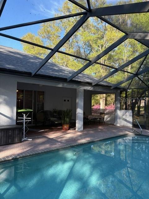 18970 Southwest 99th Street Dunnellon, FL 34432 - Photo 38 of 52 a view of a chairs and table in the patio