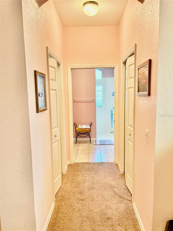 18970 Southwest 99th Street Dunnellon, FL 34432 - Photo 7 of 52 a view of a hallway with wooden floor