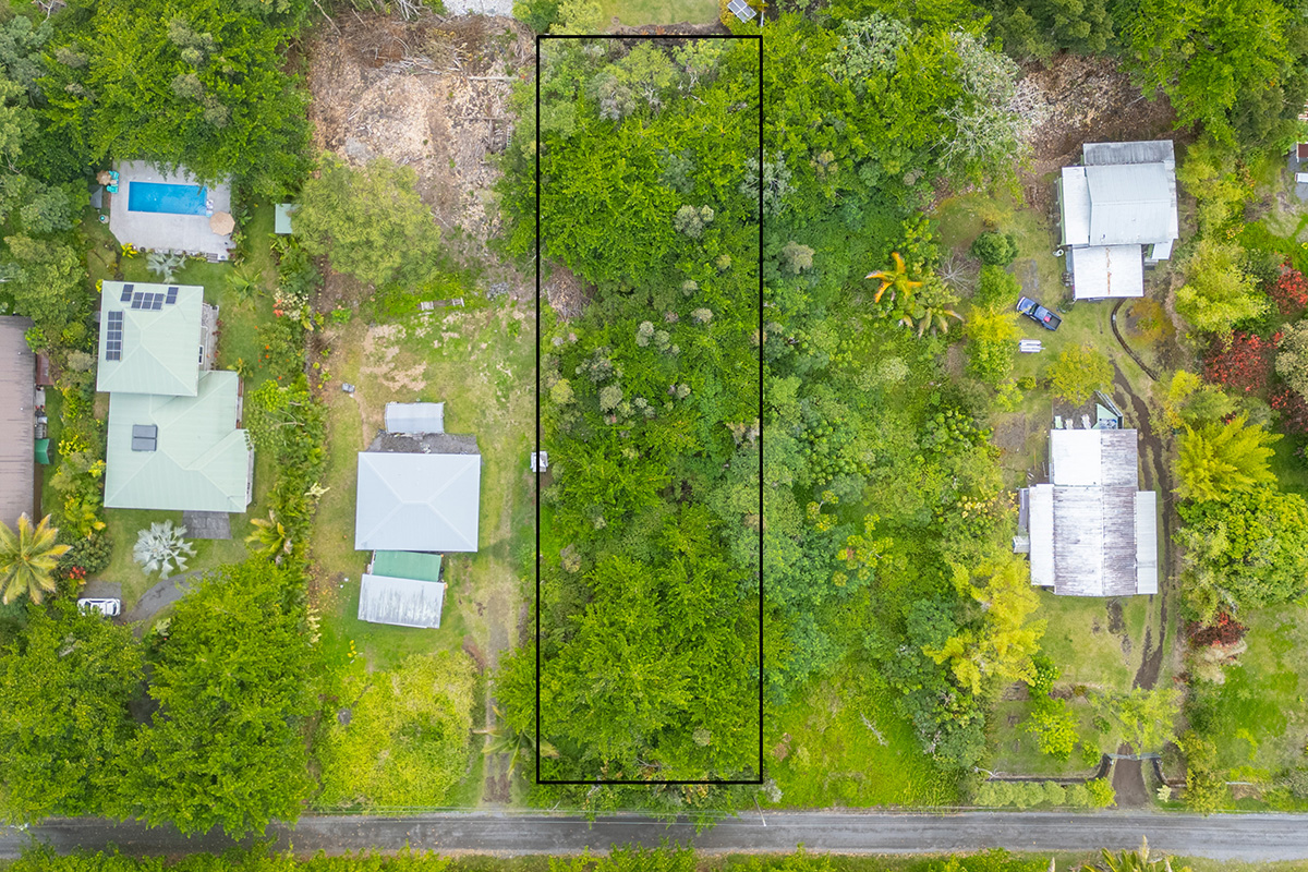 an aerial view of a house with a yard basket ball court and outdoor seating