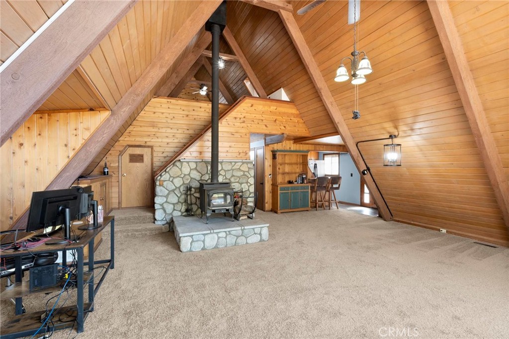 6069 Maple Avenue Angelus Oaks, CA 92305 - Photo 17 of 51 a view of an empty room with a fireplace
