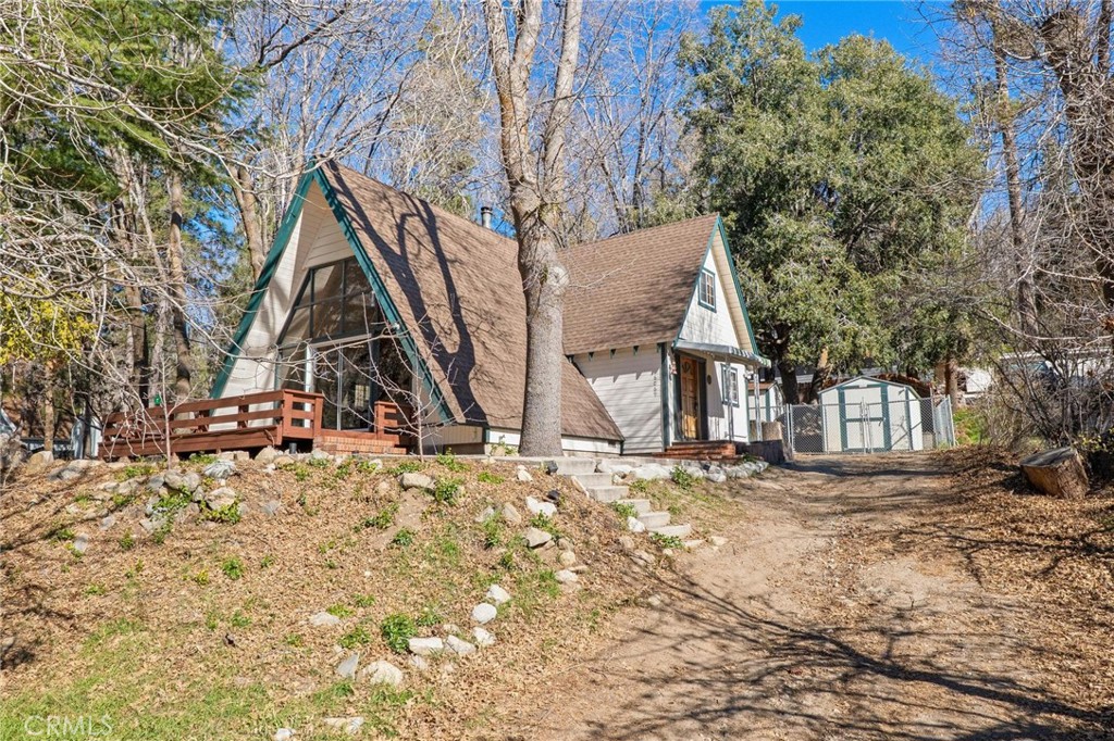 6069 Maple Avenue Angelus Oaks, CA 92305 - Photo 2 of 51 a view of a house with snow on the road