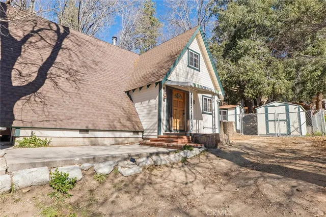 a view of a house with snow on the road