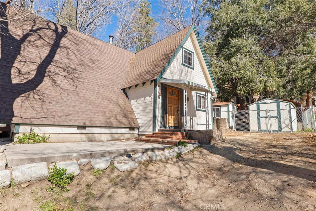 6069 Maple Avenue Angelus Oaks, CA 92305 - Photo 3 of 51 a view of a house with snow on the road