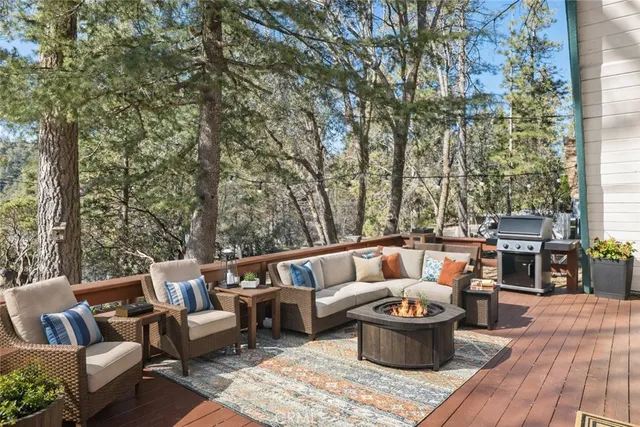 a balcony with furniture and wooden floor