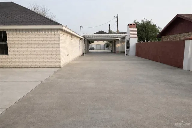 a view of a house with a backyard