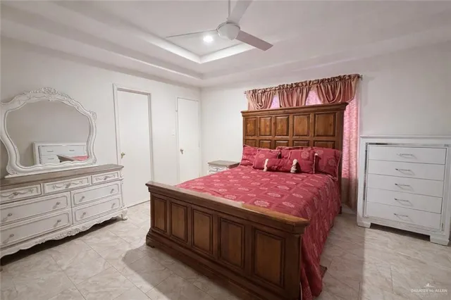 a bedroom with a bed and a dresser