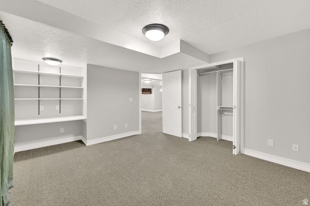 4792 Glasmann Way South Ogden, UT 84403 - Photo 59 of 70 Bedroom #4 spacious room featuring neutral carpeting, desk and built-in shelving, and a double-door closet with custom shelving and hanging rods