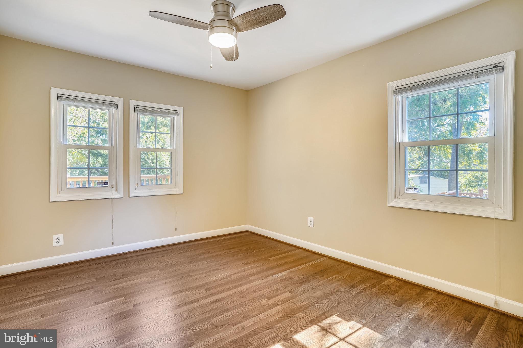 4029 Walters Court Fairfax, VA 22030 - Photo 13 of 29 Primary Bedroom w/ Hardwood Flooring + Ceiling Fan