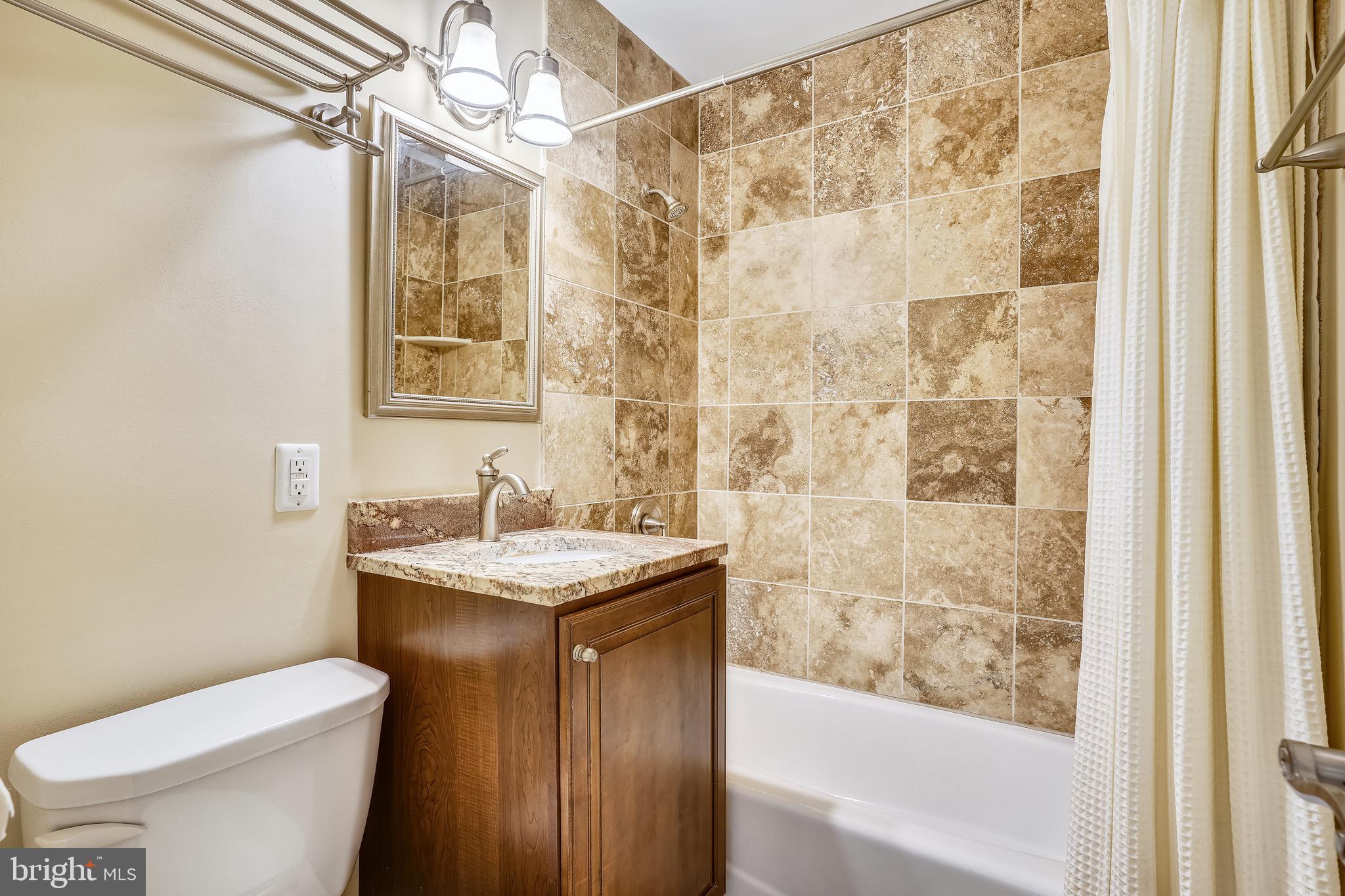 4029 Walters Court Fairfax, VA 22030 - Photo 20 of 29 Updated Secondary Bathroom with Tub / Shower Combo