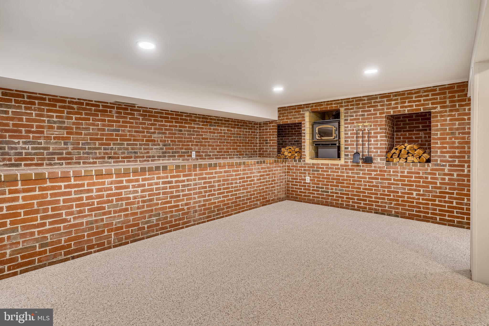 4029 Walters Court Fairfax, VA 22030 - Photo 22 of 29 Recreation Room with Fireplace and Brick Ledge
