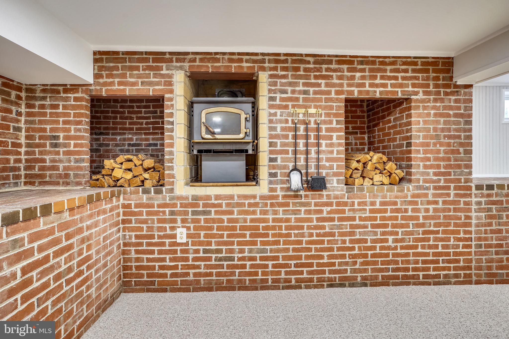 4029 Walters Court Fairfax, VA 22030 - Photo 23 of 29 Recreation Room with Fireplace and Wood Storage