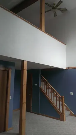 a view of staircase with lots of wooden floor