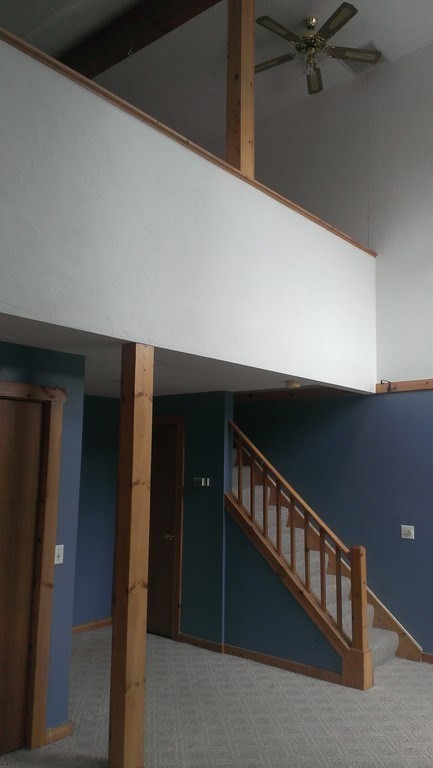 a view of staircase with lots of wooden floor