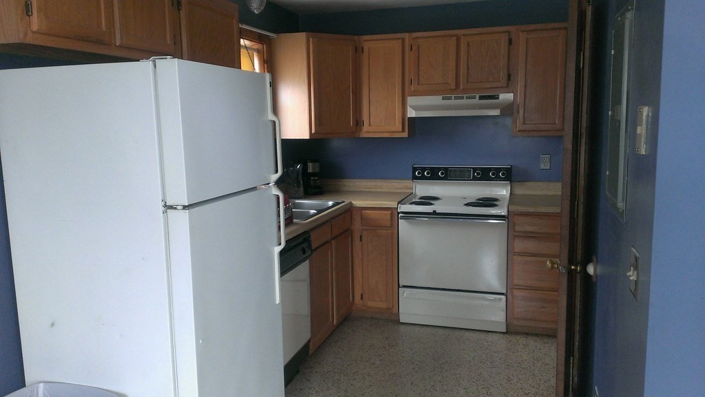 191 City Depot Road, Unit B Charlton, MA 01507 - Photo 3 of 12 a white refrigerator freezer sitting in a kitchen