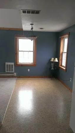 a view of empty room with windows