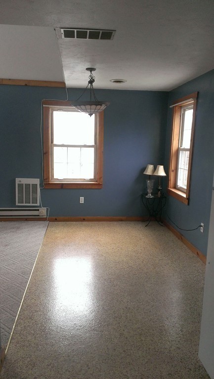 191 City Depot Road, Unit B Charlton, MA 01507 - Photo 5 of 12 a view of empty room with windows