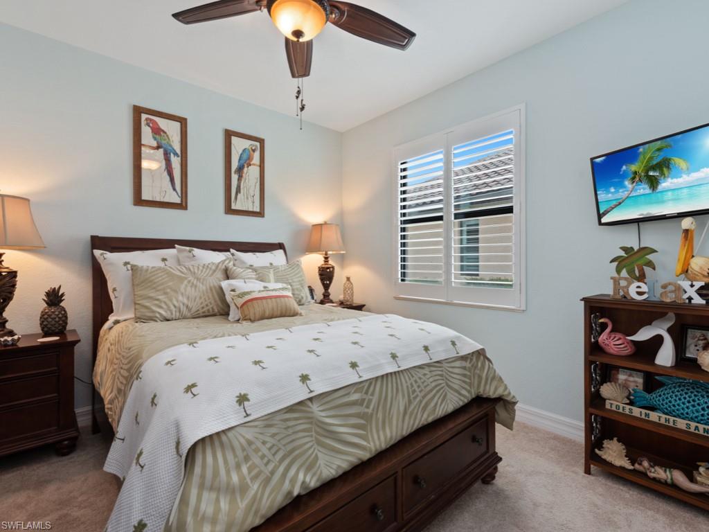 9507 Piacere Way Naples, FL 34113 - Photo 13 of 32 a bedroom with a bed and a window
