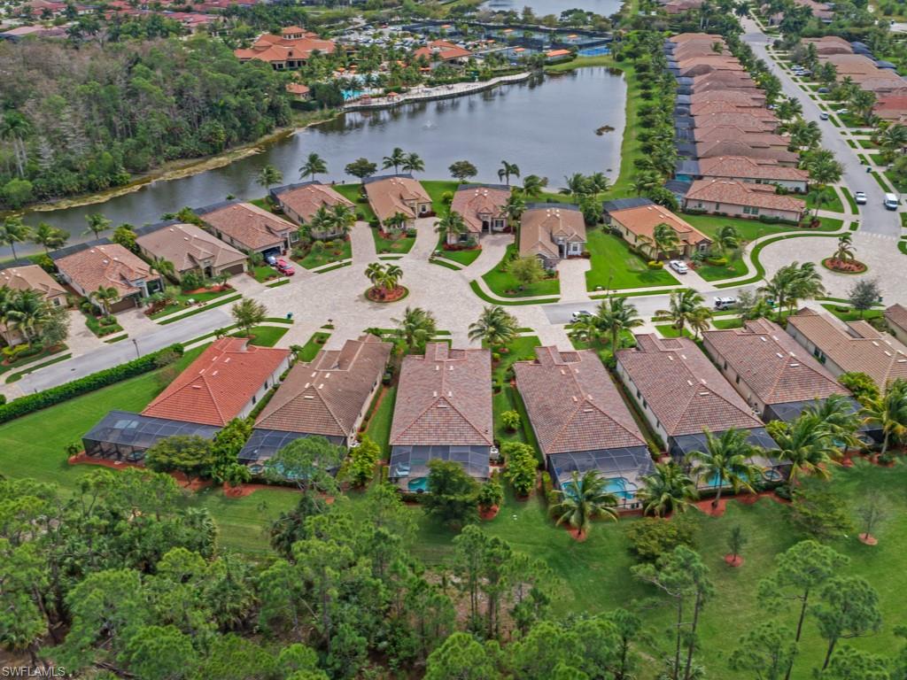 9507 Piacere Way Naples, FL 34113 - Photo 17 of 32 an aerial view of multiple houses with yard