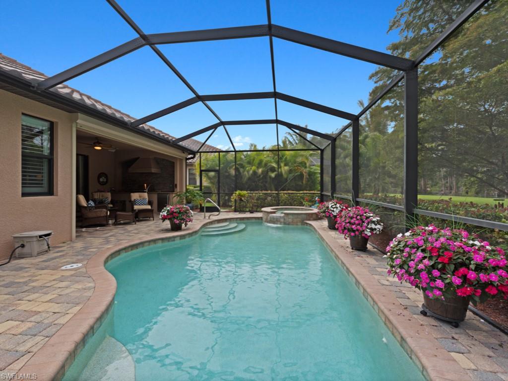 9507 Piacere Way Naples, FL 34113 - Photo 20 of 32 a view of a backyard with sitting area
