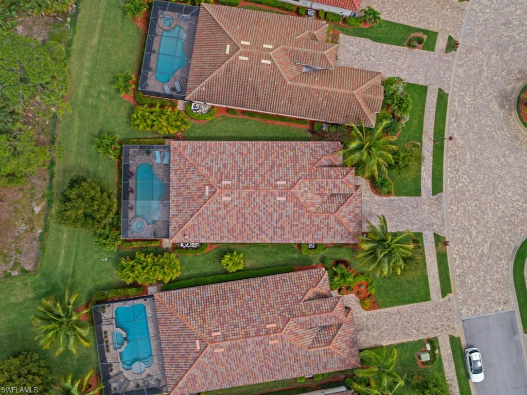 9507 Piacere Way Naples, FL 34113 - Photo 24 of 32 an aerial view of a house with a yard and a bench