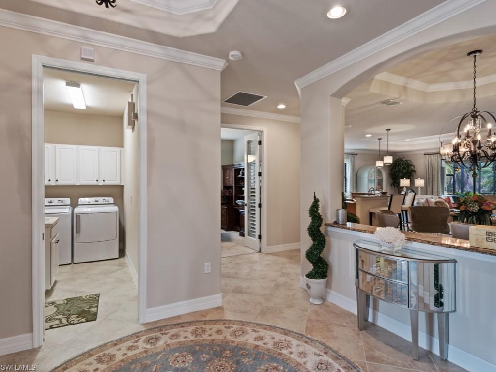 9507 Piacere Way Naples, FL 34113 - Photo 8 of 32 a room with lots of counter top space and furniture
