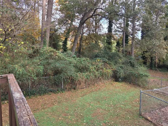 a view of a yard with trees