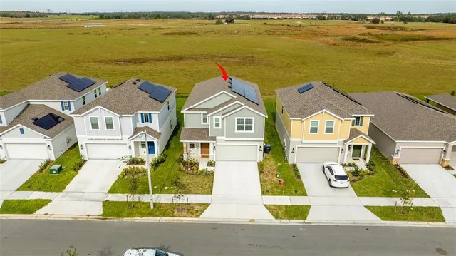 a view of houses with an ocean view