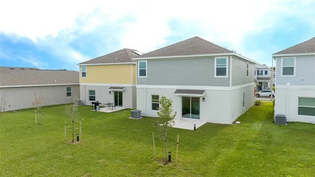 a view of swimming pool with a lawn chairs