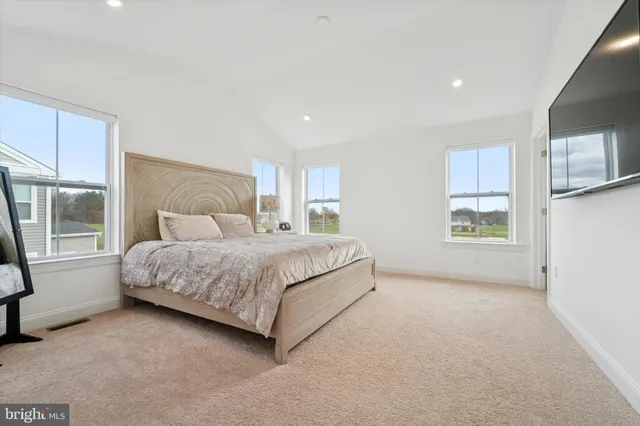 a bedroom with furniture and a baby crib