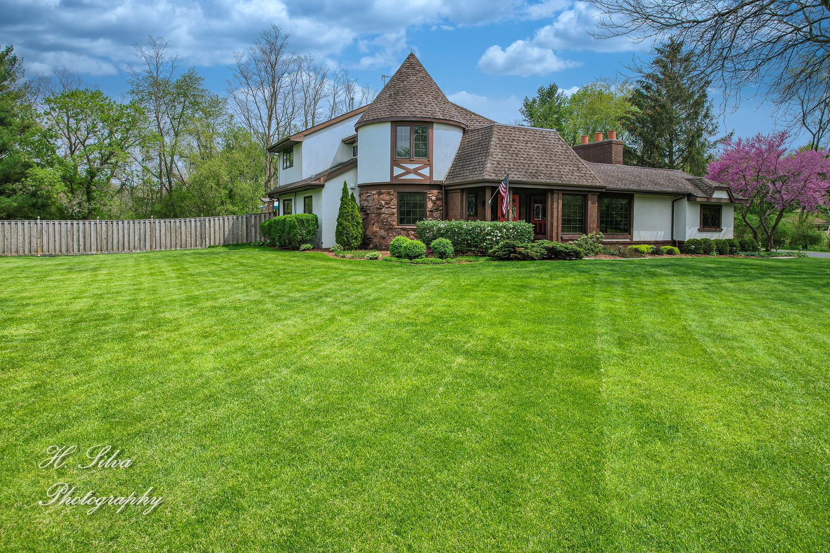 a front view of a house with a yard