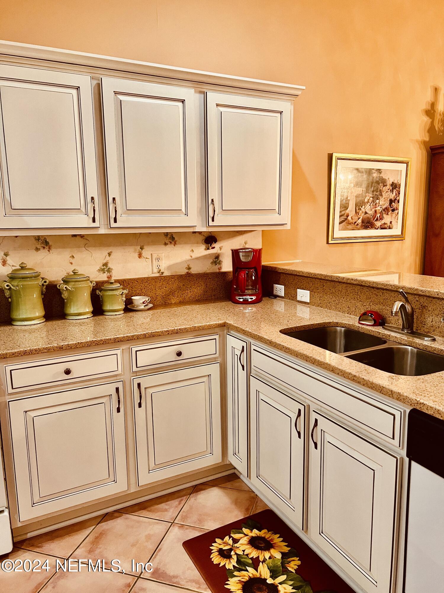 91 Fox Valley Drive Orange Park, FL 32073 - Photo 14 of 28 a kitchen with stainless steel appliances granite countertop a sink stove and cabinets