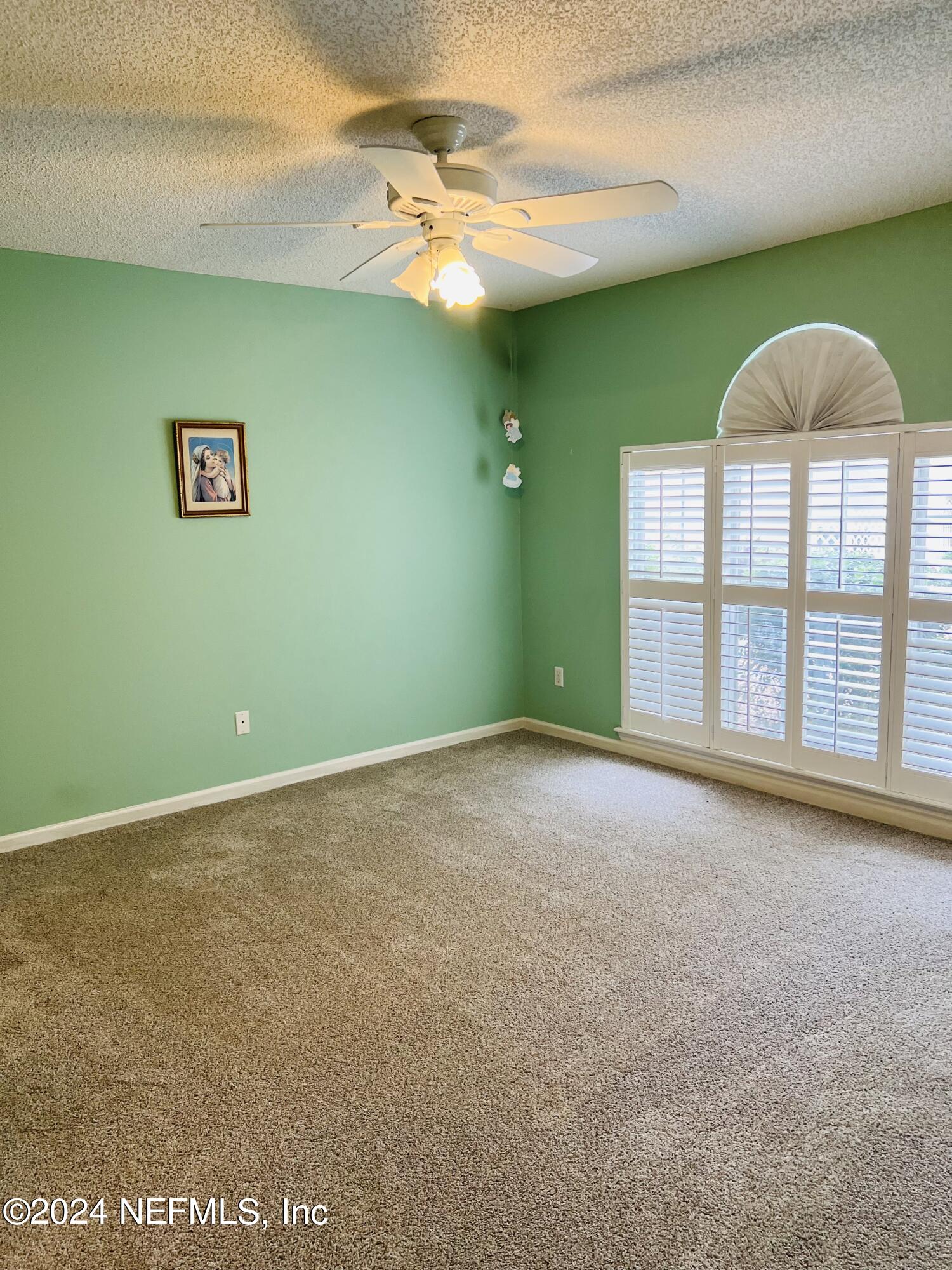 91 Fox Valley Drive Orange Park, FL 32073 - Photo 21 of 28 a view of an empty room with a window