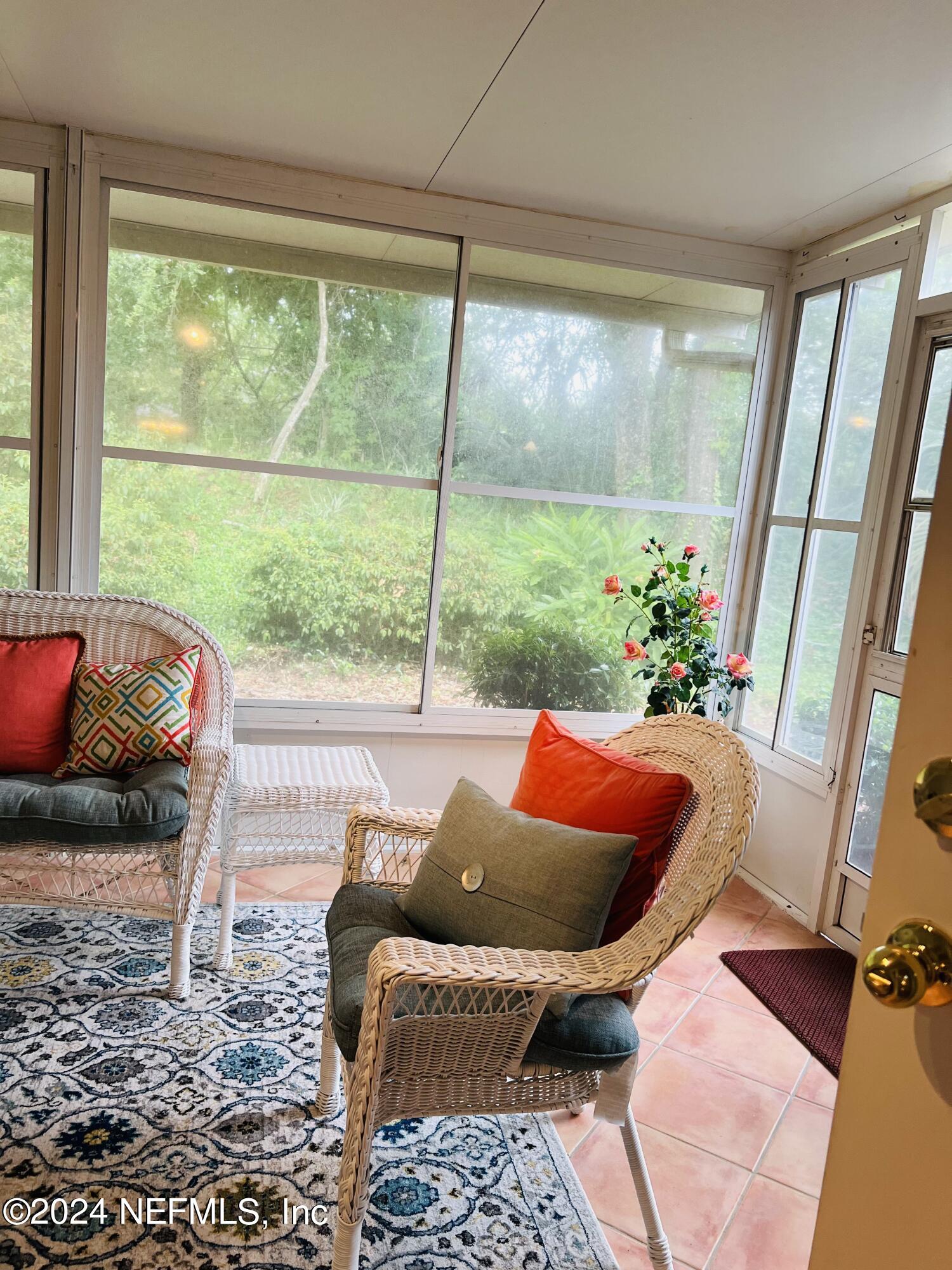 91 Fox Valley Drive Orange Park, FL 32073 - Photo 26 of 28 a outdoor living space with furniture and a potted plant