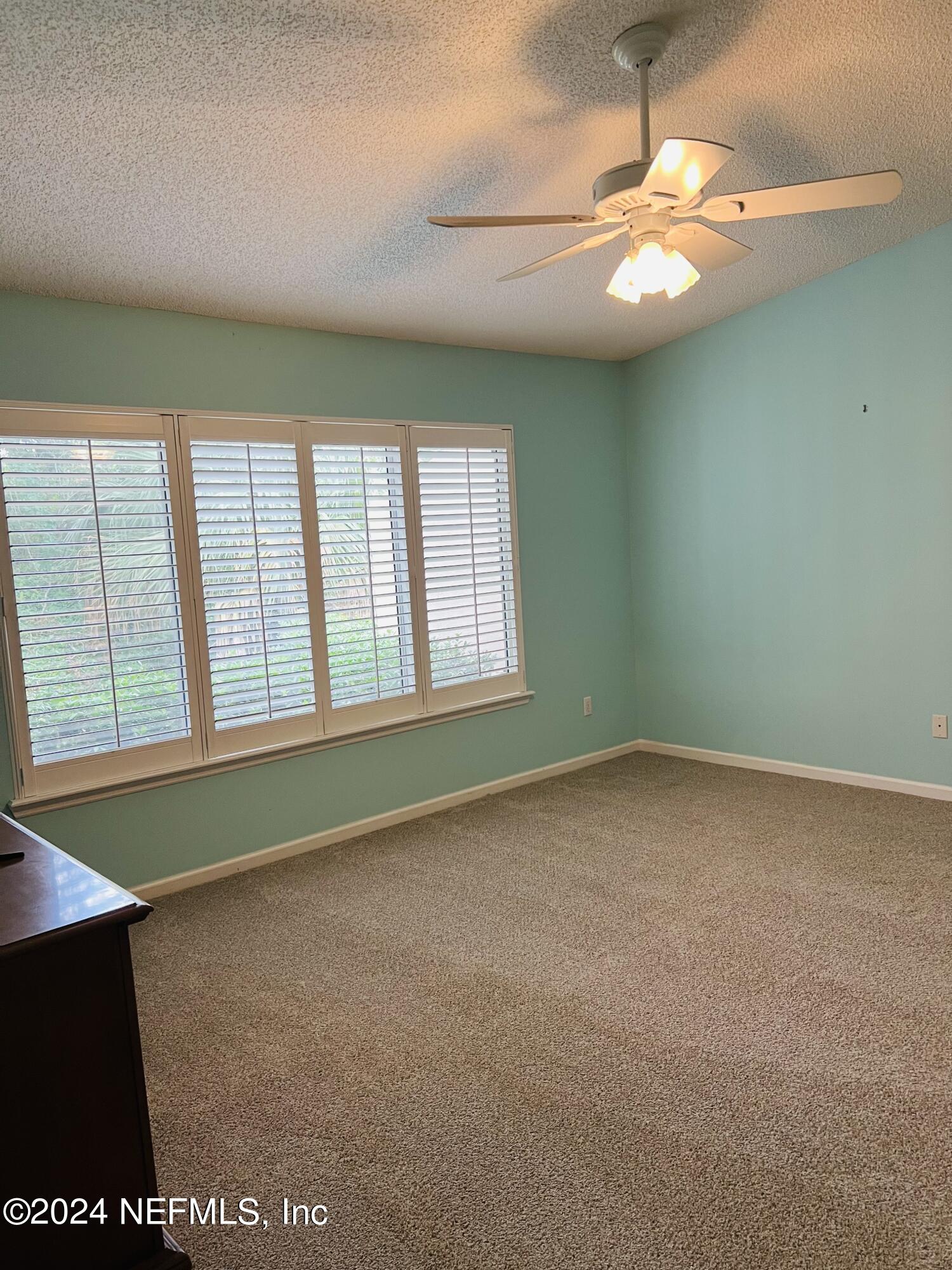 91 Fox Valley Drive Orange Park, FL 32073 - Photo 6 of 28 an empty room with a window