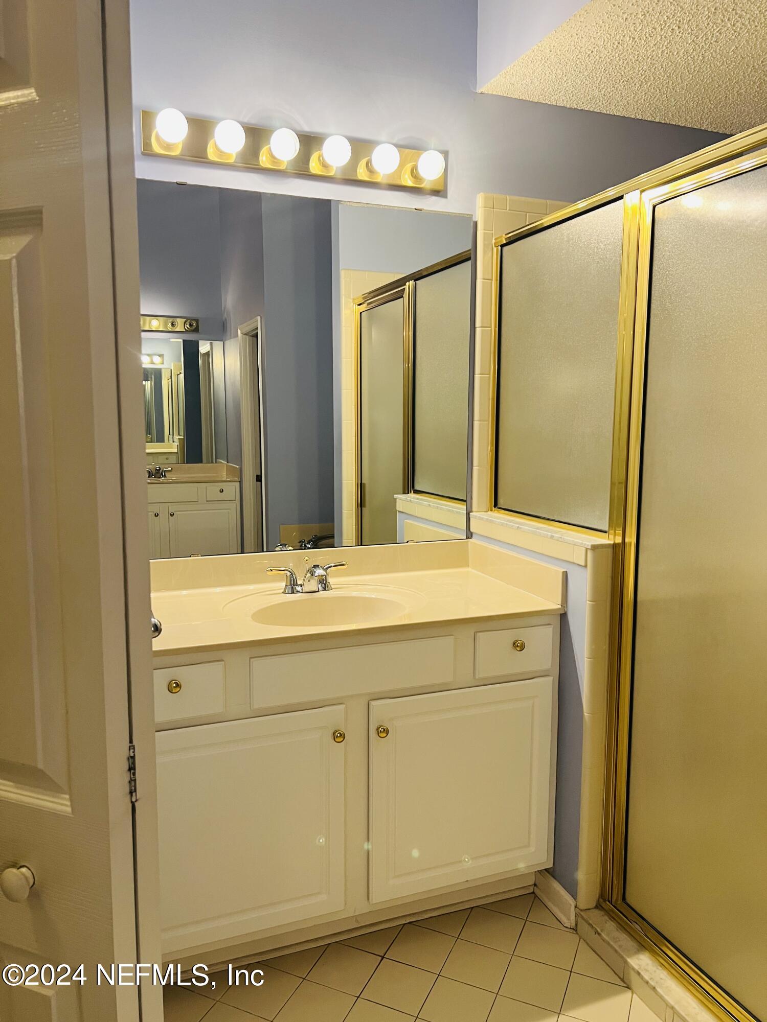 91 Fox Valley Drive Orange Park, FL 32073 - Photo 10 of 28 a bathroom with a double vanity sink and a mirror