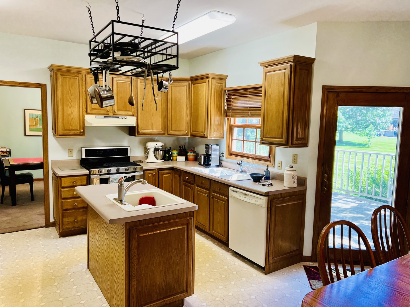 10087 Branch Road Rochelle, IL 61068 - Photo 11 of 27 a kitchen with stainless steel appliances granite countertop a stove top oven a sink a counter top space and appliances