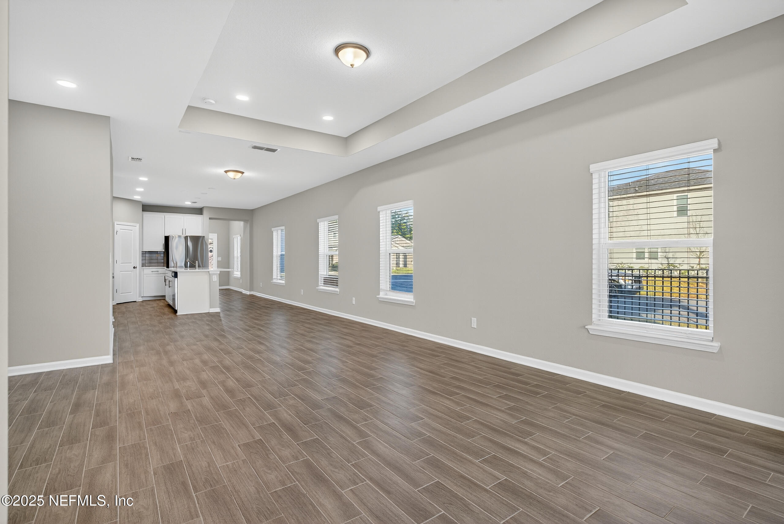 75598 Blackbird Drive Yulee, FL 32097 - Photo 15 of 30 a view of an empty room with wooden floor and a window