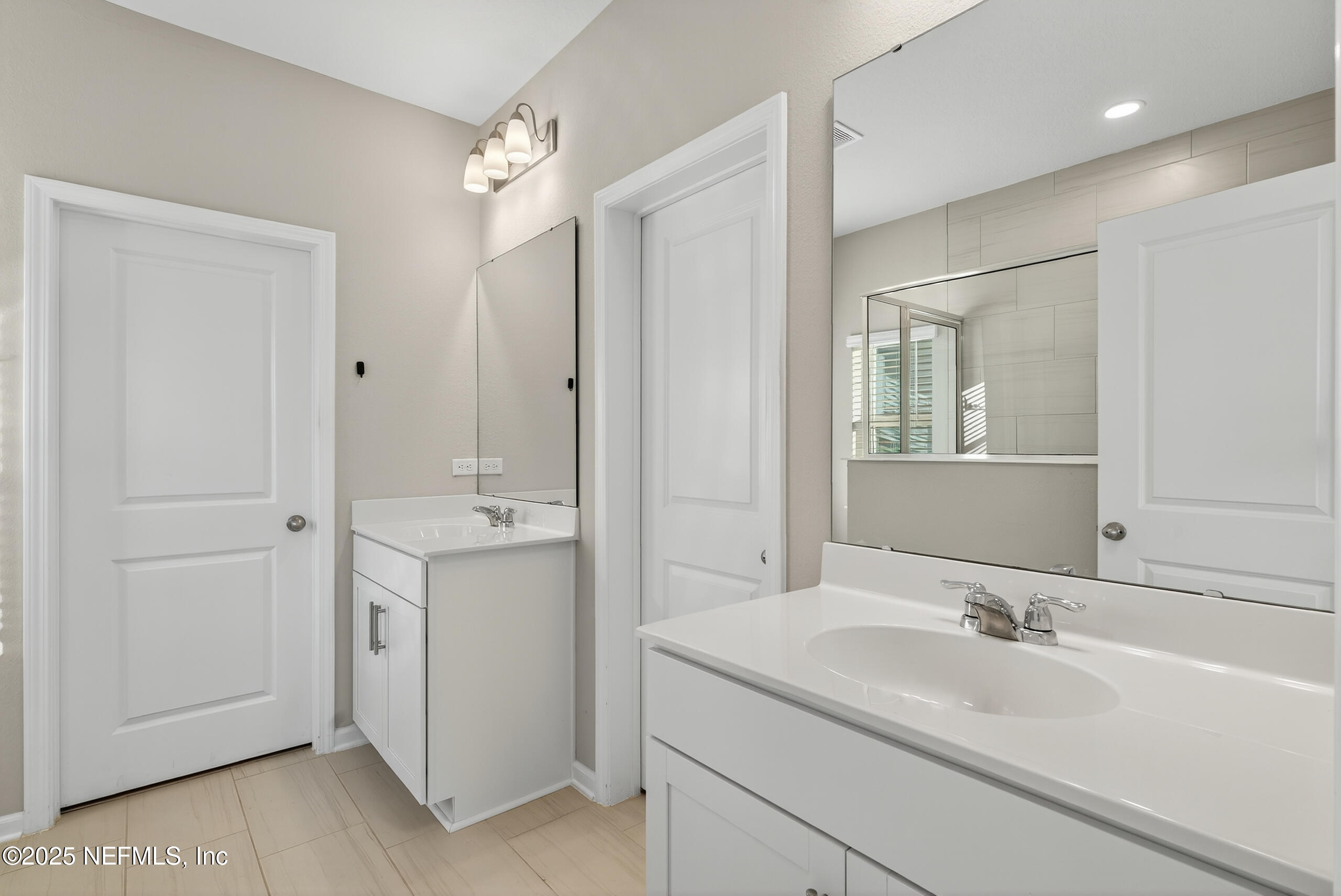 75598 Blackbird Drive Yulee, FL 32097 - Photo 18 of 30 a bathroom with a sink and a mirror